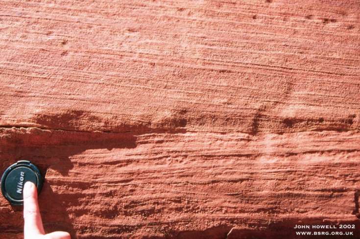 Wavy laminated damp-sand flat deposits overlain by low angle cross-stratified, wind rippled deposits. Canyonlands Utah.